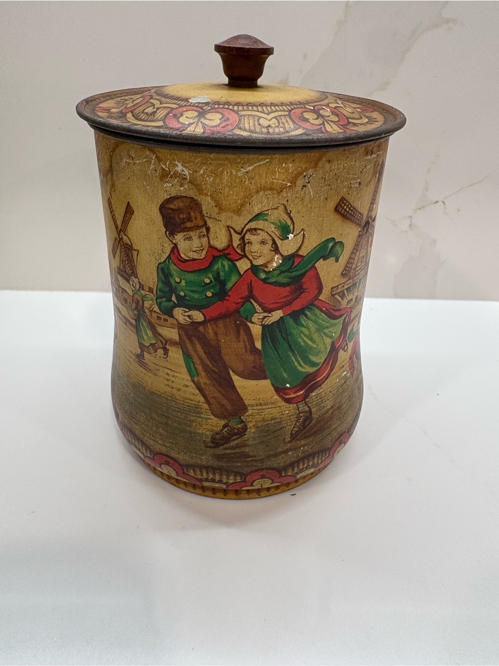 Antique English Biscuit Tin with Dutch Children skating & windmill scene. 1920s